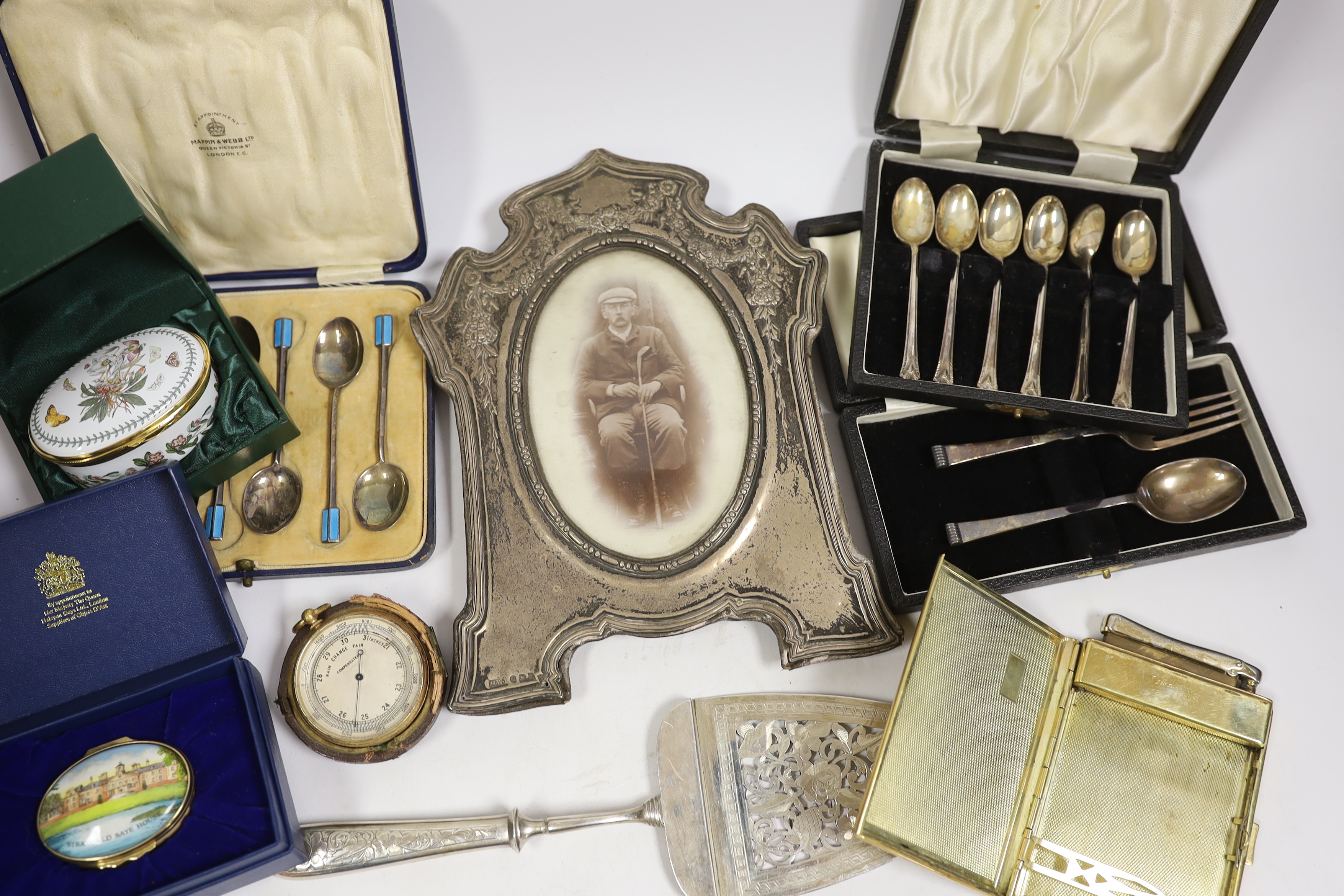 Miscellaneous items including three cased sets of silver flatware including enamelled teaspoons, Halcyon Days boxes, cased barometer, gilt metal case, silver mounted photograph frame, etc.